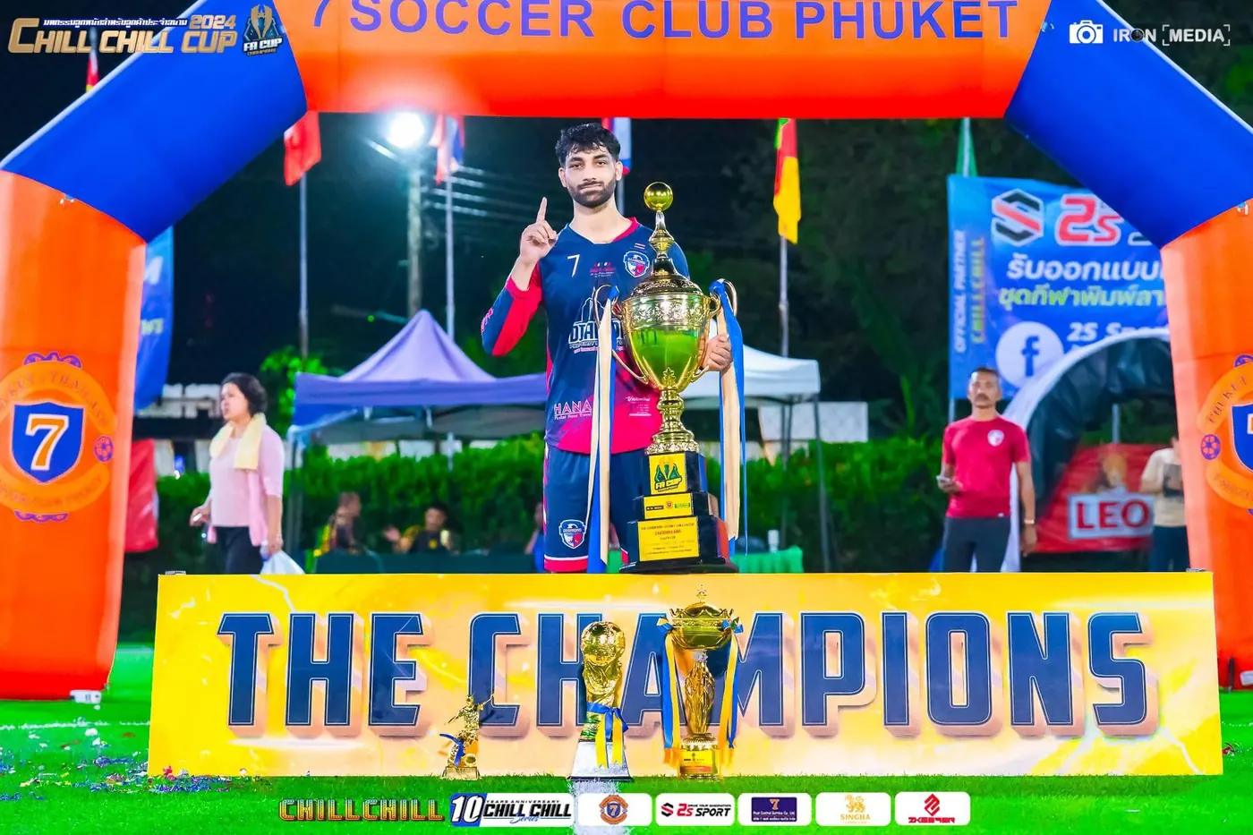 Holding the trophy after winning a cup in Phuket