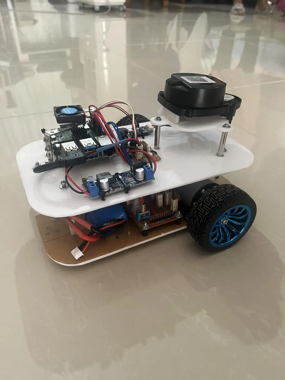 The service robot with its LIDAR sensor on top